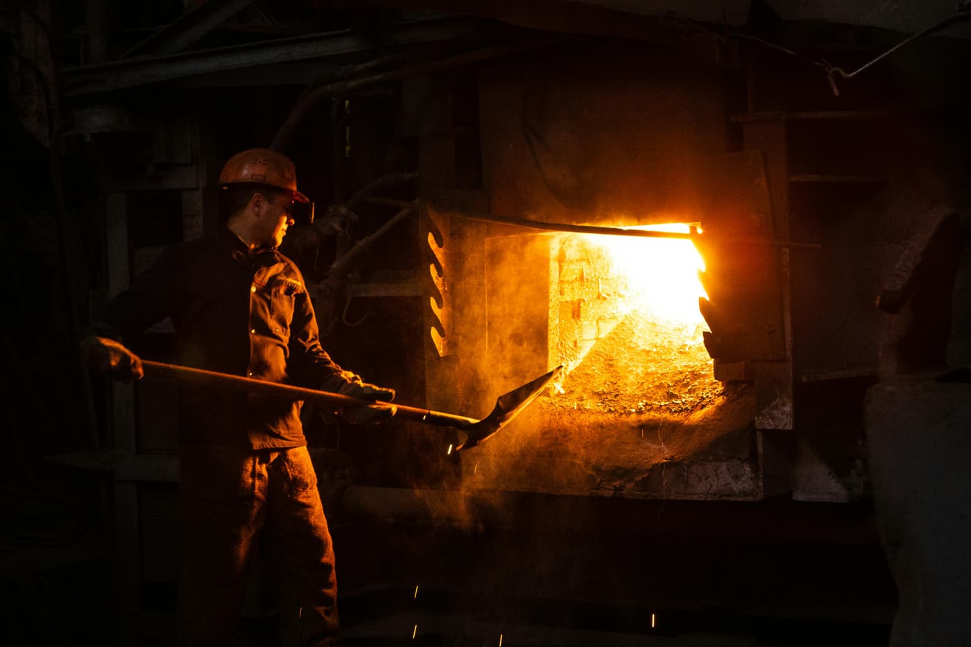 Refractory plants worker handling high-temperature material at Easton Refractories