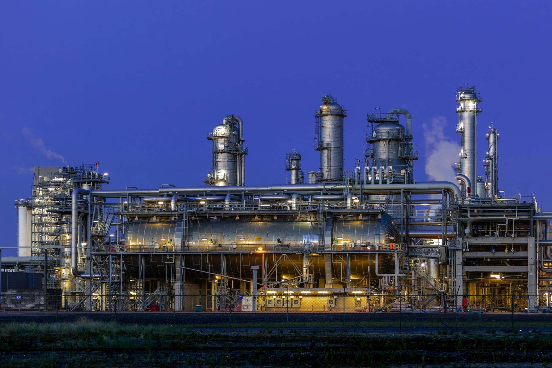 Industrial refractory manufacturing facility at dusk